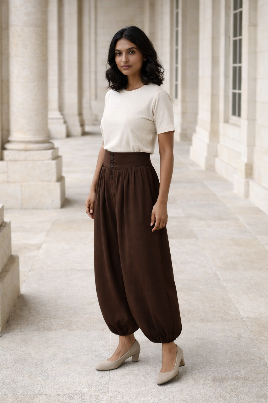 Brown high-waisted women's baggy trousers with button detail and elasticated cuffs