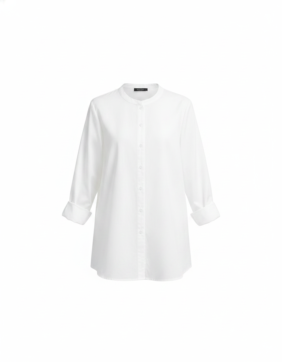 Women's white top with frilled collar and multicolor button-detail placket, long sleeves rolled up, worn with beige wide-leg pants.