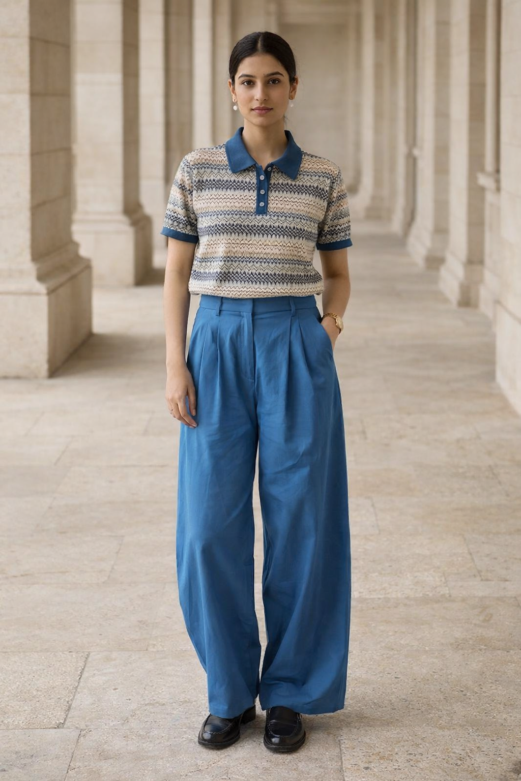 Cream women's top with blue polo collar, three-button placket, short sleeves and zigzag patterned knitting