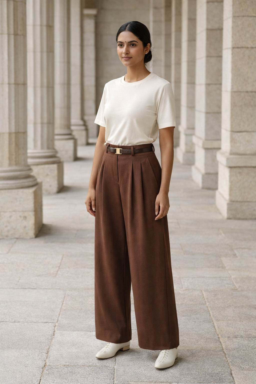 Brown high-waist baggy trousers for women with front pleats and a black belt