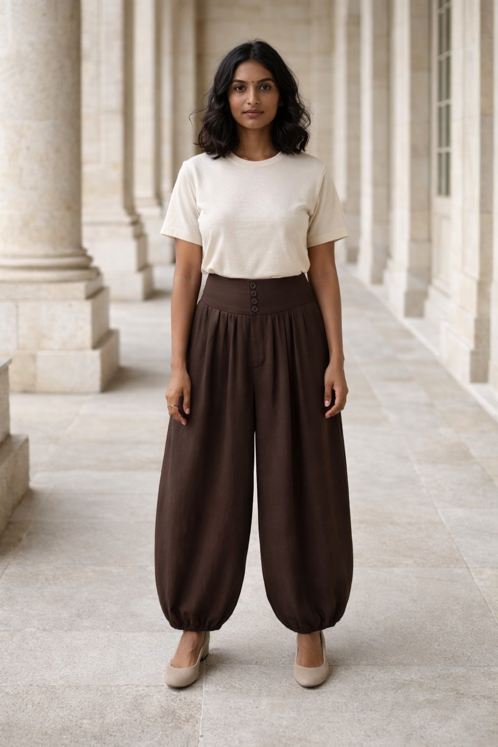 Brown high-waisted women's baggy trousers with button detail and elasticated cuffs