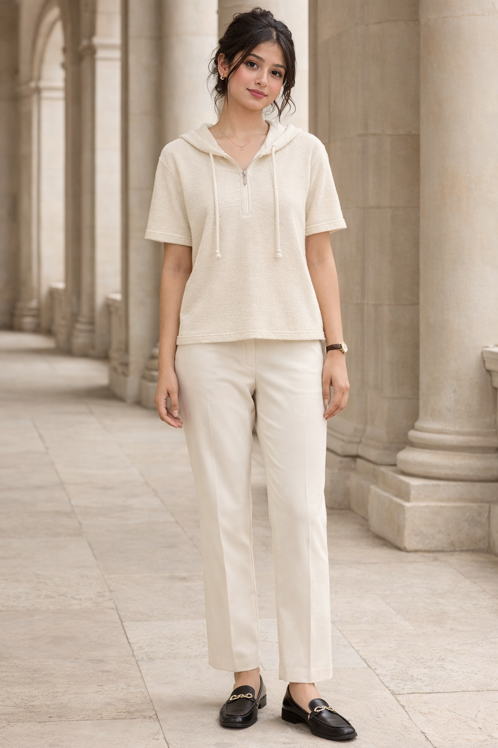 Cream oversized hooded knit top with short sleeves and zipper front worn by woman