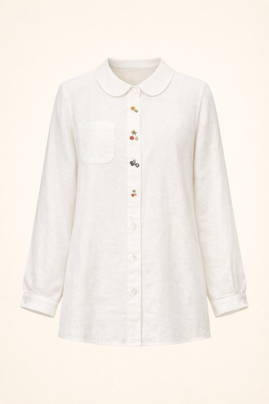 White oversized women's top with Peter Pan collar, button-detail front placket, long sleeves, and a chest pocket